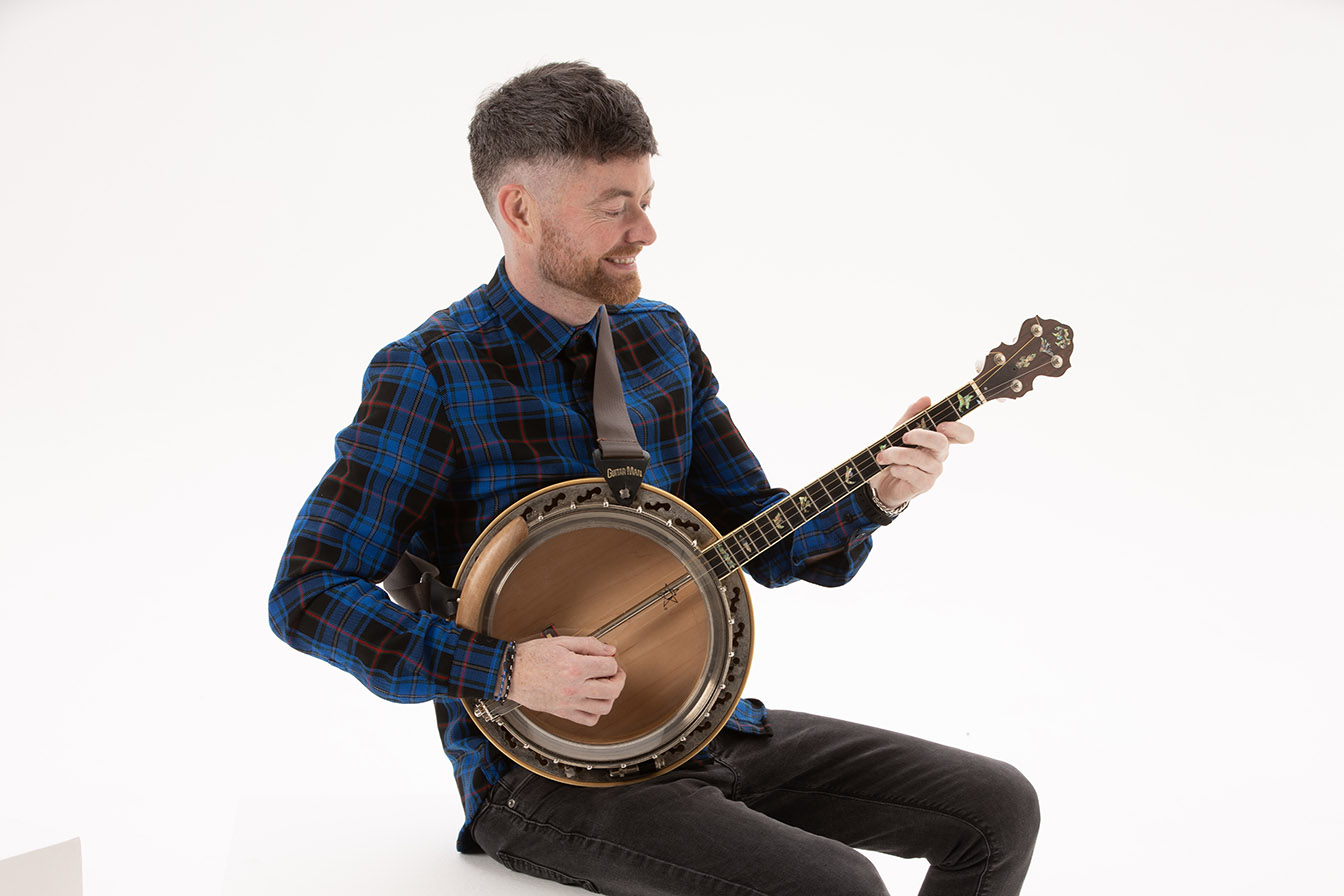 Banjo player playing Irish tenor banjo